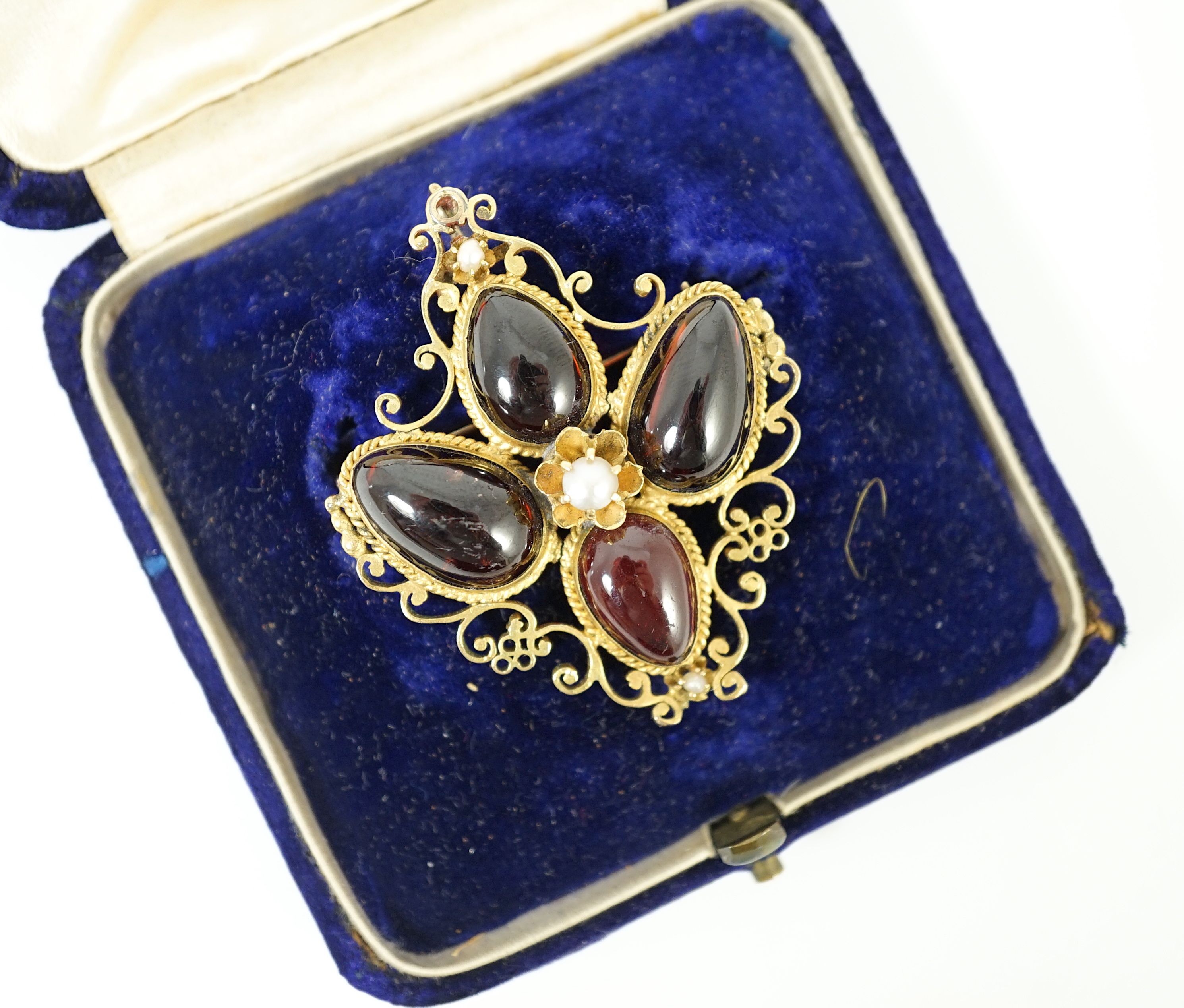 A Victorian gold, four stone garnet and three stone split pearl set mourning pendant brooch